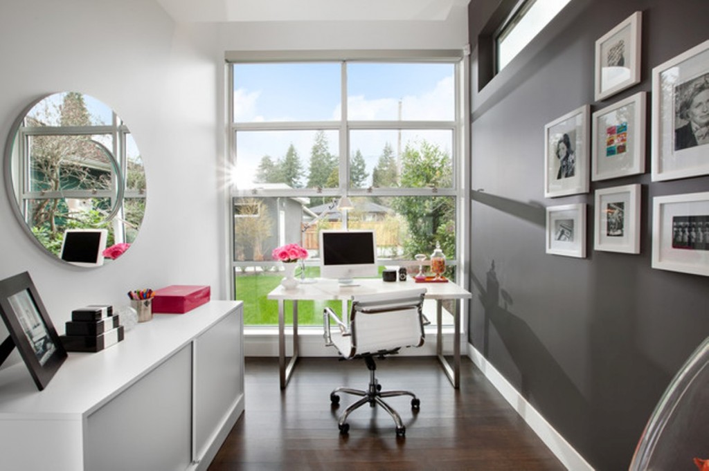 modern-home-office-narrow-small-space-with-swivel-chair-and-desk-lamp-and-hardwood-flooring-with-grey-wall-and-dresser-and-mirror