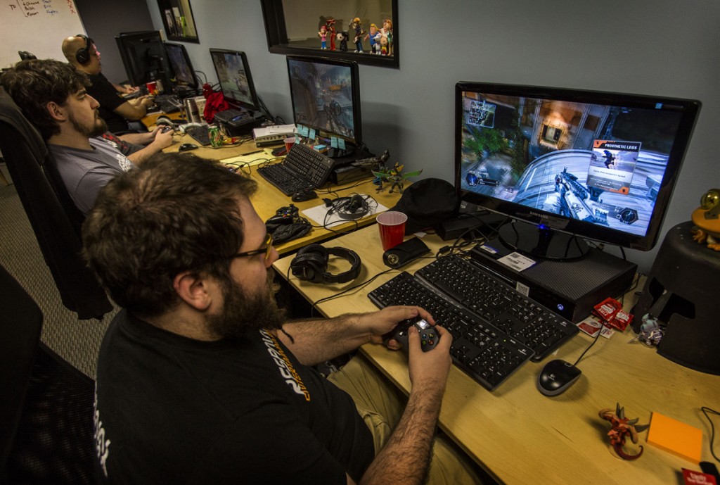 ***SUNDAY CALENDAR STORY FOR MARCH 9, 2014. DO NOT USE PRIOR TO PUBLICATION*** VAN NUYS, CA - FEBRUARY 27, 2014 - QA testers, including Mark Grimenstein, front, testing the new video game "Titanfall" at Respawn Entertainment video game development studio, Thursday, February 27, 2014. The studio is launching the new video game on March 11, 2014. (Ricardo DeAratanha/Los Angeles Times).